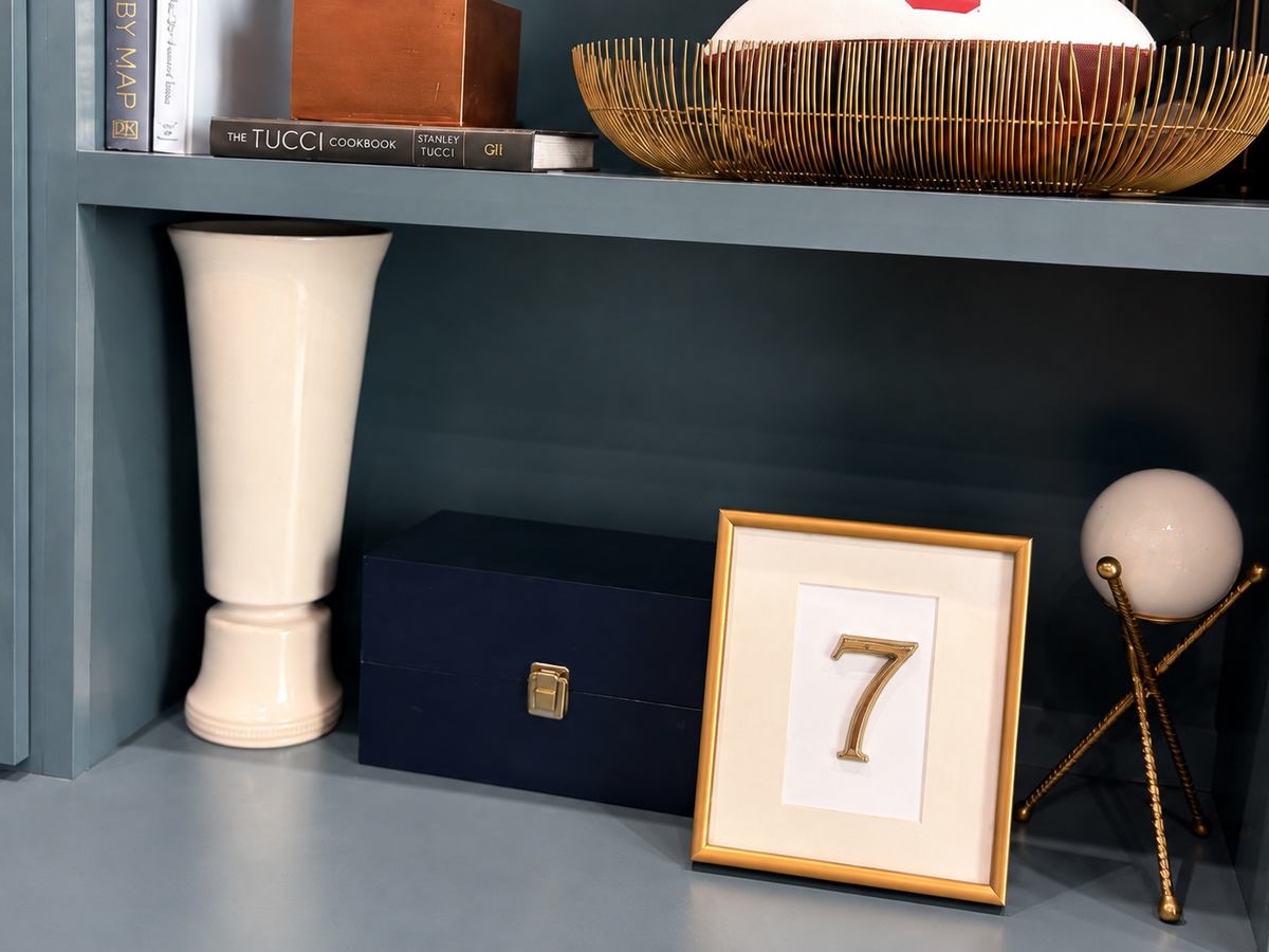 Gold number 7 framed as a decorative object